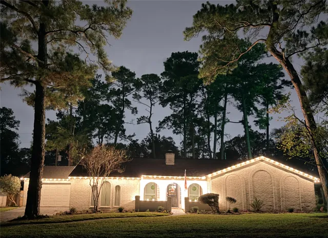 a white house with lots of trees