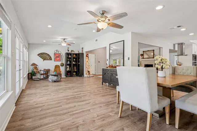 a living room with furniture and kitchen view