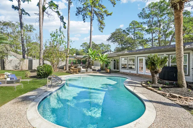a view of a swimming pool with a patio