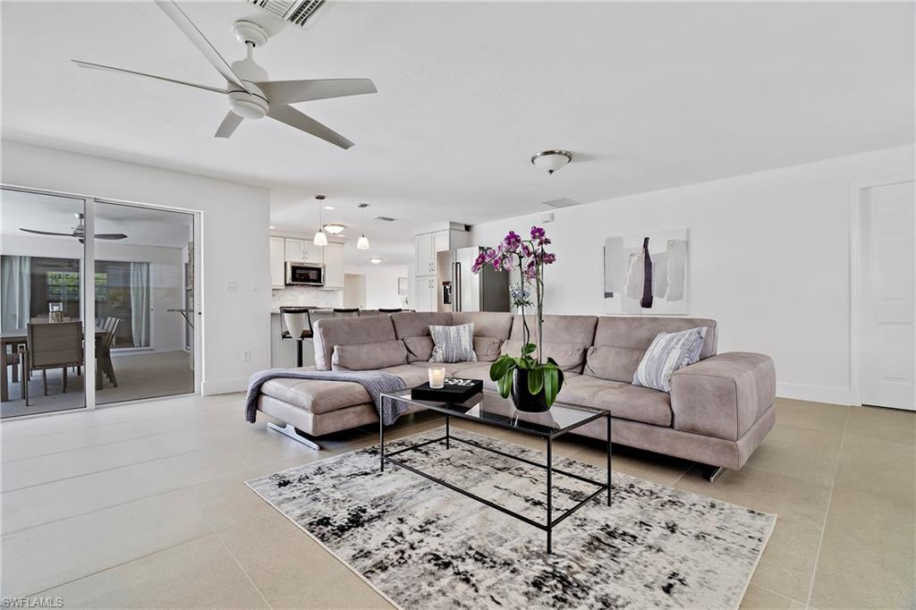 740 Orchid Drive Naples, FL 34102 - Photo 15 of 33 a living room with furniture and kitchen view