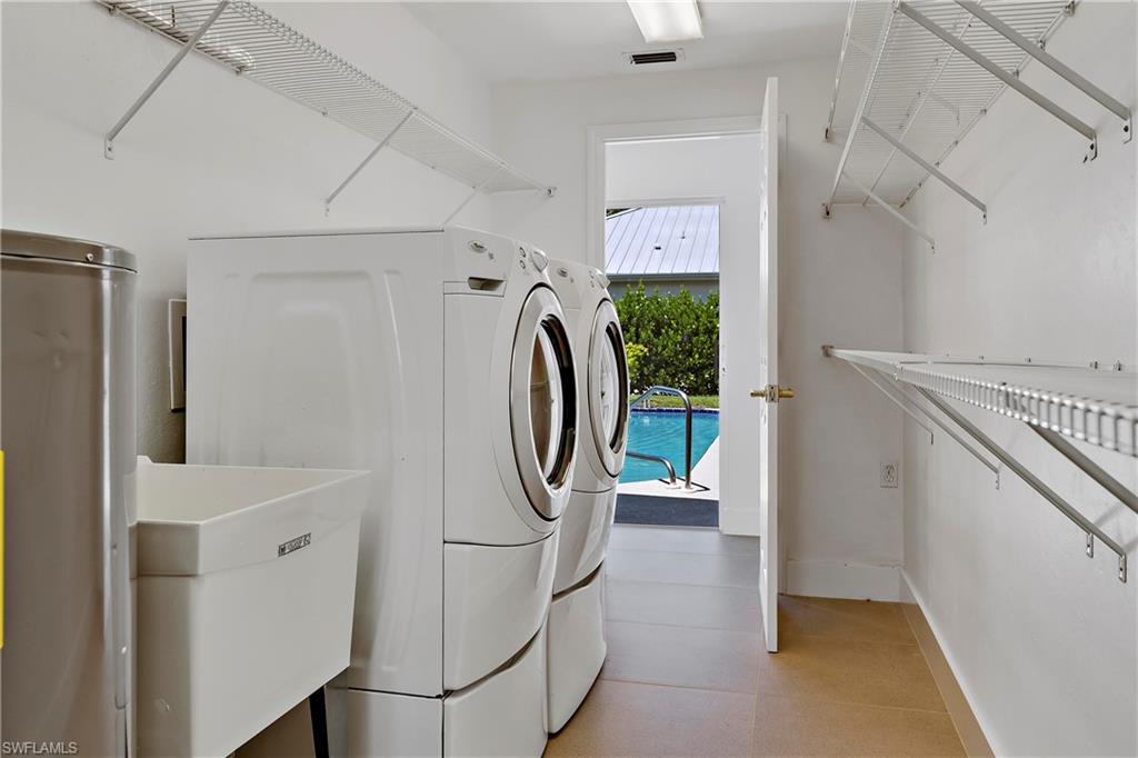 740 Orchid Drive Naples, FL 34102 - Photo 23 of 33 a utility room with dryer and washer