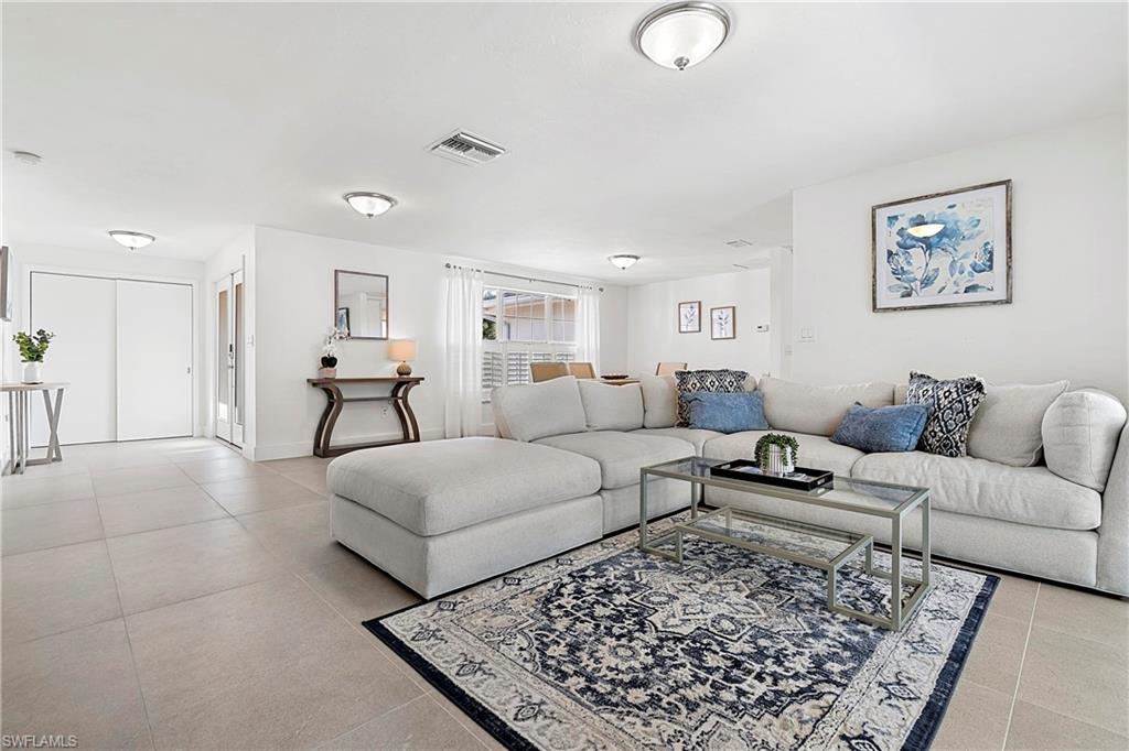 740 Orchid Drive Naples, FL 34102 - Photo 5 of 33 a living room with furniture and a rug