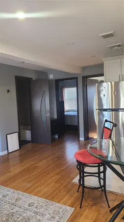 a room with furniture pool table and rug