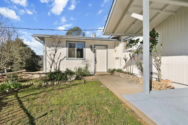 a front view of a house with a yard