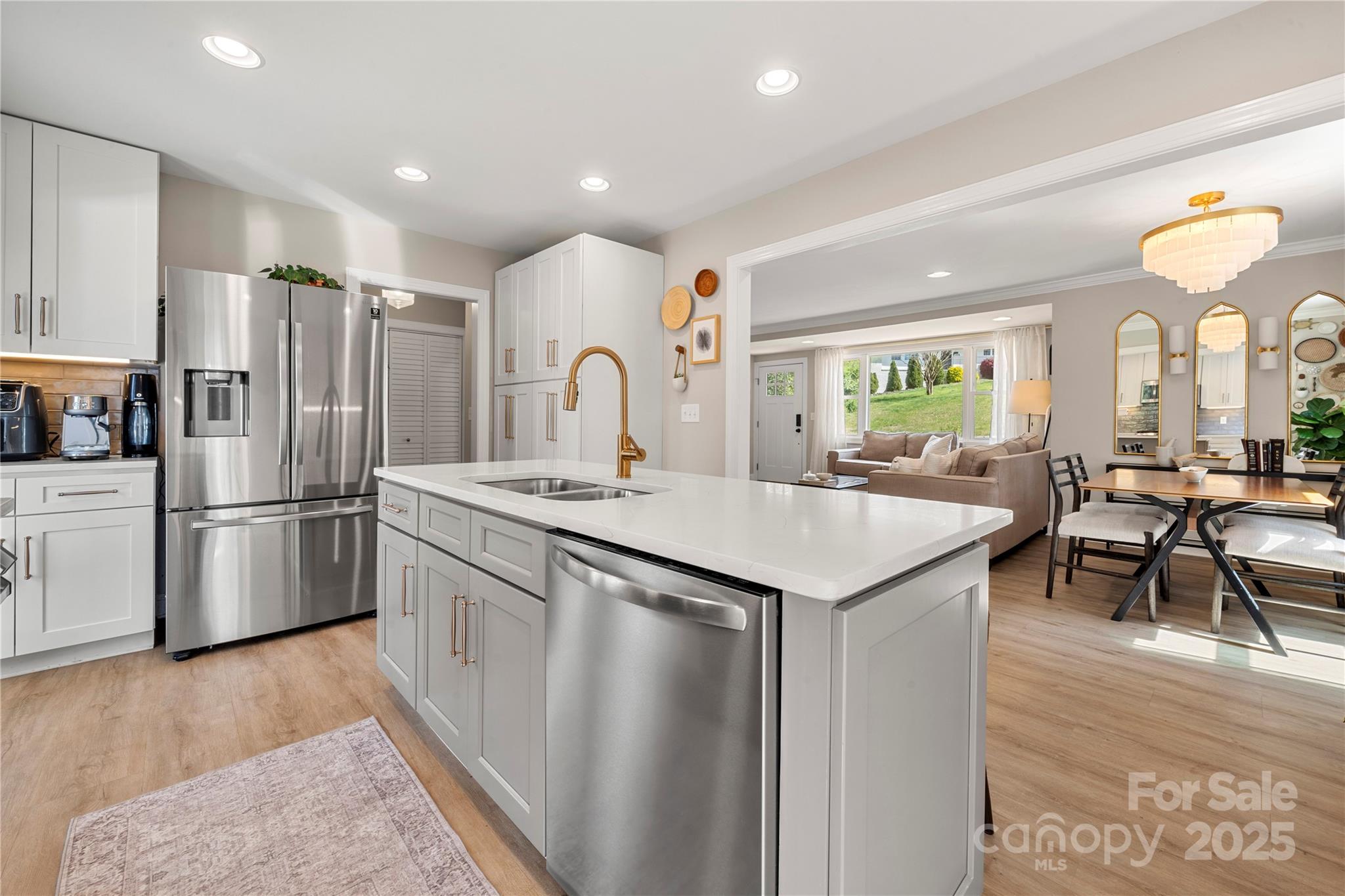 4820 Valley Stream Road Charlotte, NC 28209 - Photo 1 of 37 a kitchen with stainless steel appliances granite countertop a refrigerator a stove a sink a dining table and chairs with wooden floor