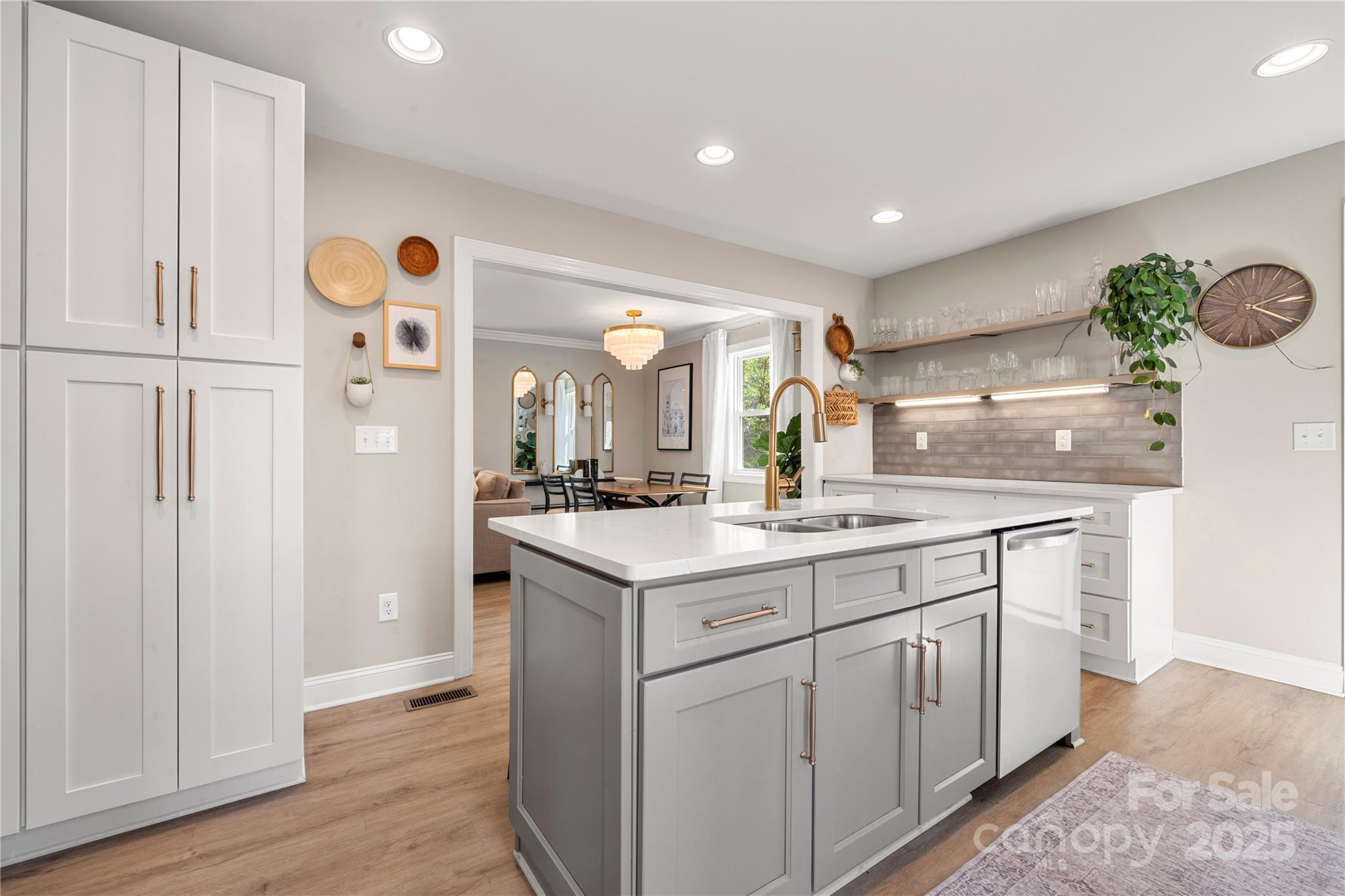 4820 Valley Stream Road Charlotte, NC 28209 - Photo 13 of 37 a kitchen with a sink and a refrigerator