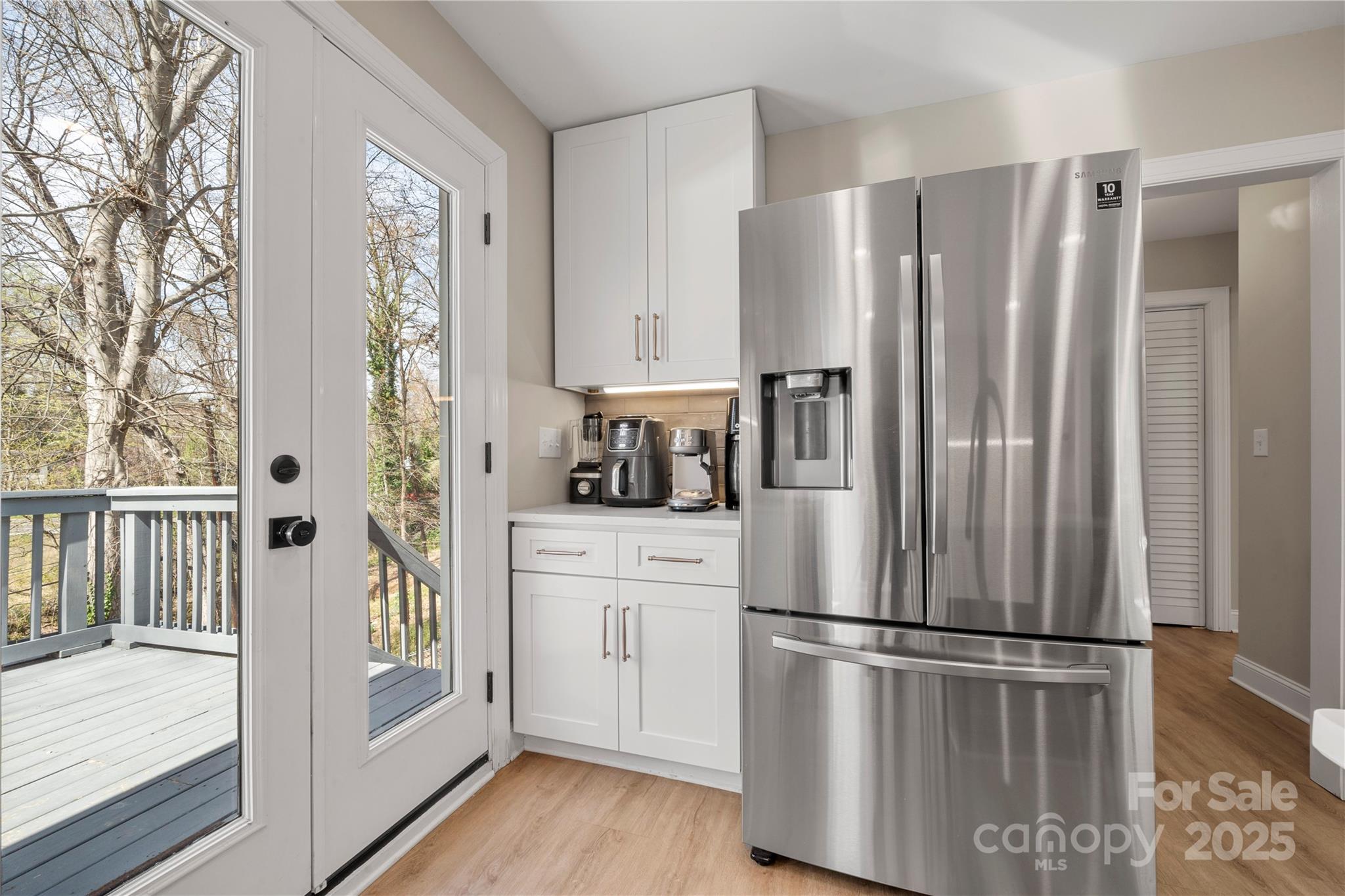 4820 Valley Stream Road Charlotte, NC 28209 - Photo 14 of 37 a kitchen with stainless steel appliances a refrigerator sink and cabinets