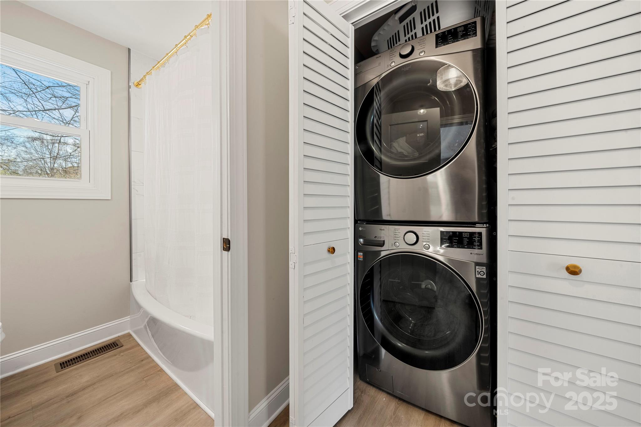 4820 Valley Stream Road Charlotte, NC 28209 - Photo 18 of 37 a utility room with dryer and washer