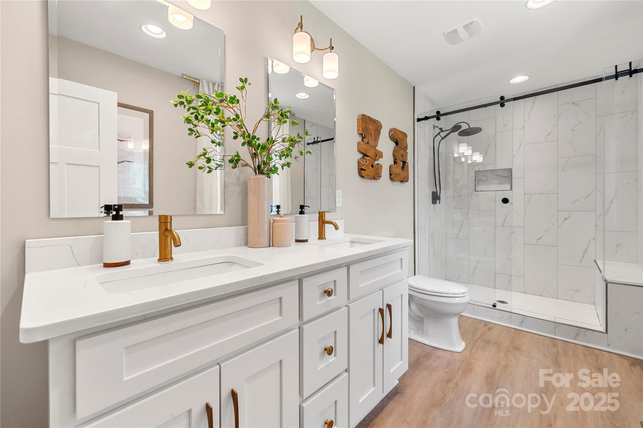 4820 Valley Stream Road Charlotte, NC 28209 - Photo 20 of 37 a bathroom with a sink a toilet and shower