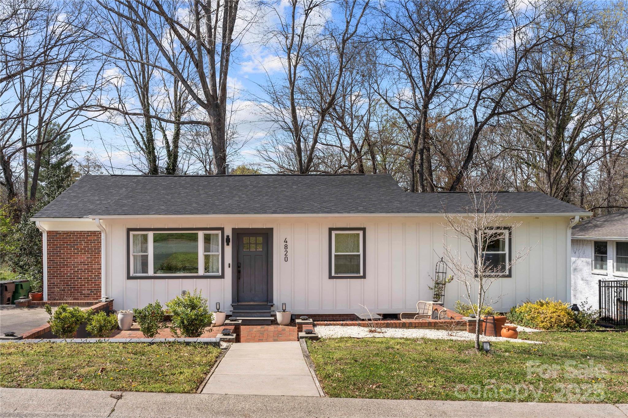 4820 Valley Stream Road Charlotte, NC 28209 - Photo 2 of 37 front view of house with a yard