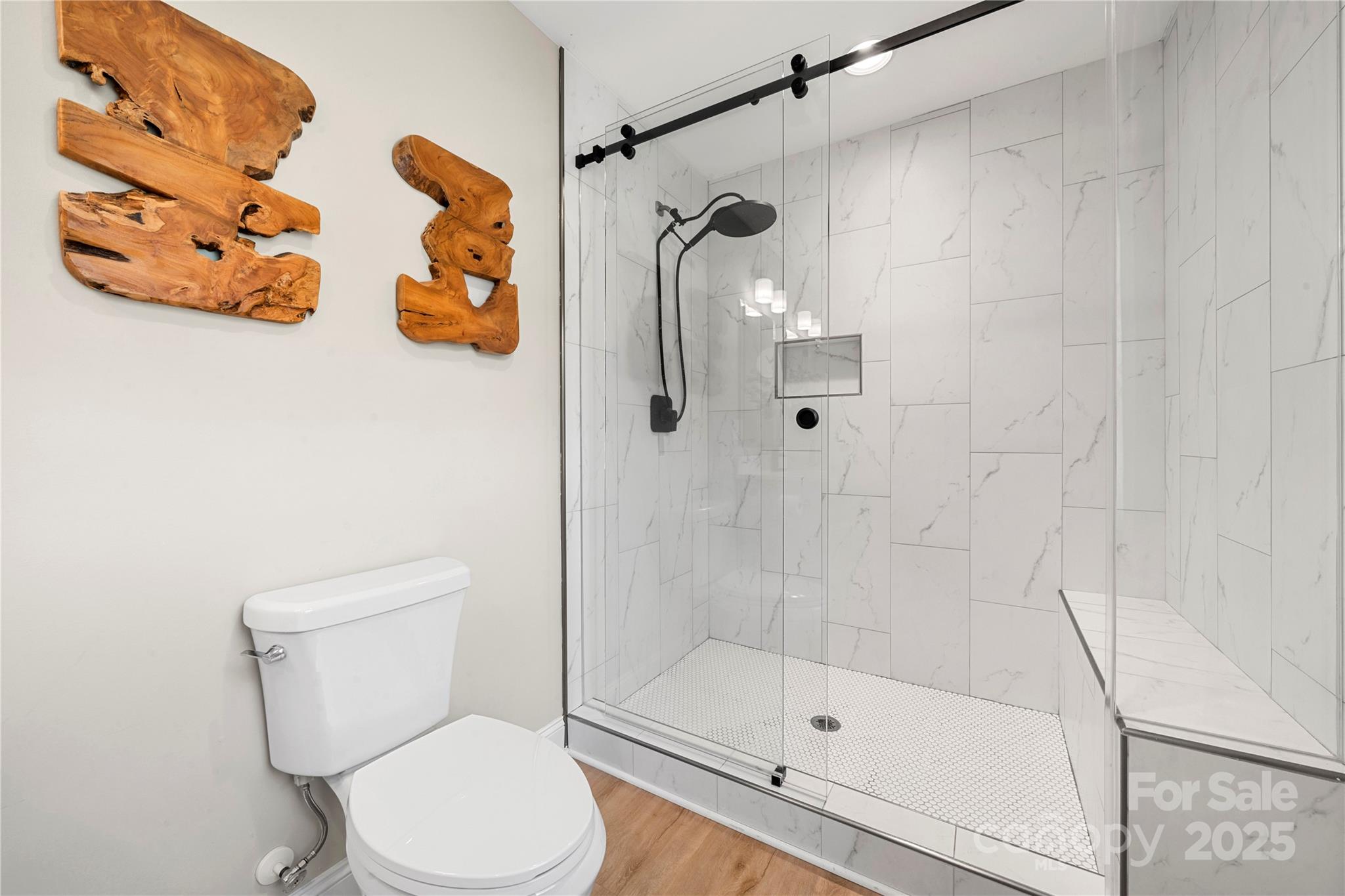 4820 Valley Stream Road Charlotte, NC 28209 - Photo 21 of 37 a white toilet sitting next to a bathroom sink