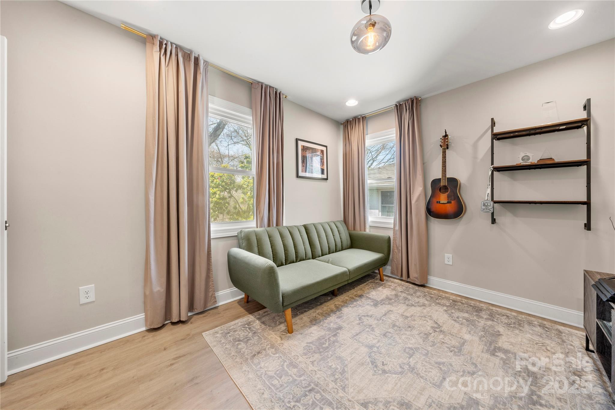 4820 Valley Stream Road Charlotte, NC 28209 - Photo 27 of 37 a living room with furniture and a window
