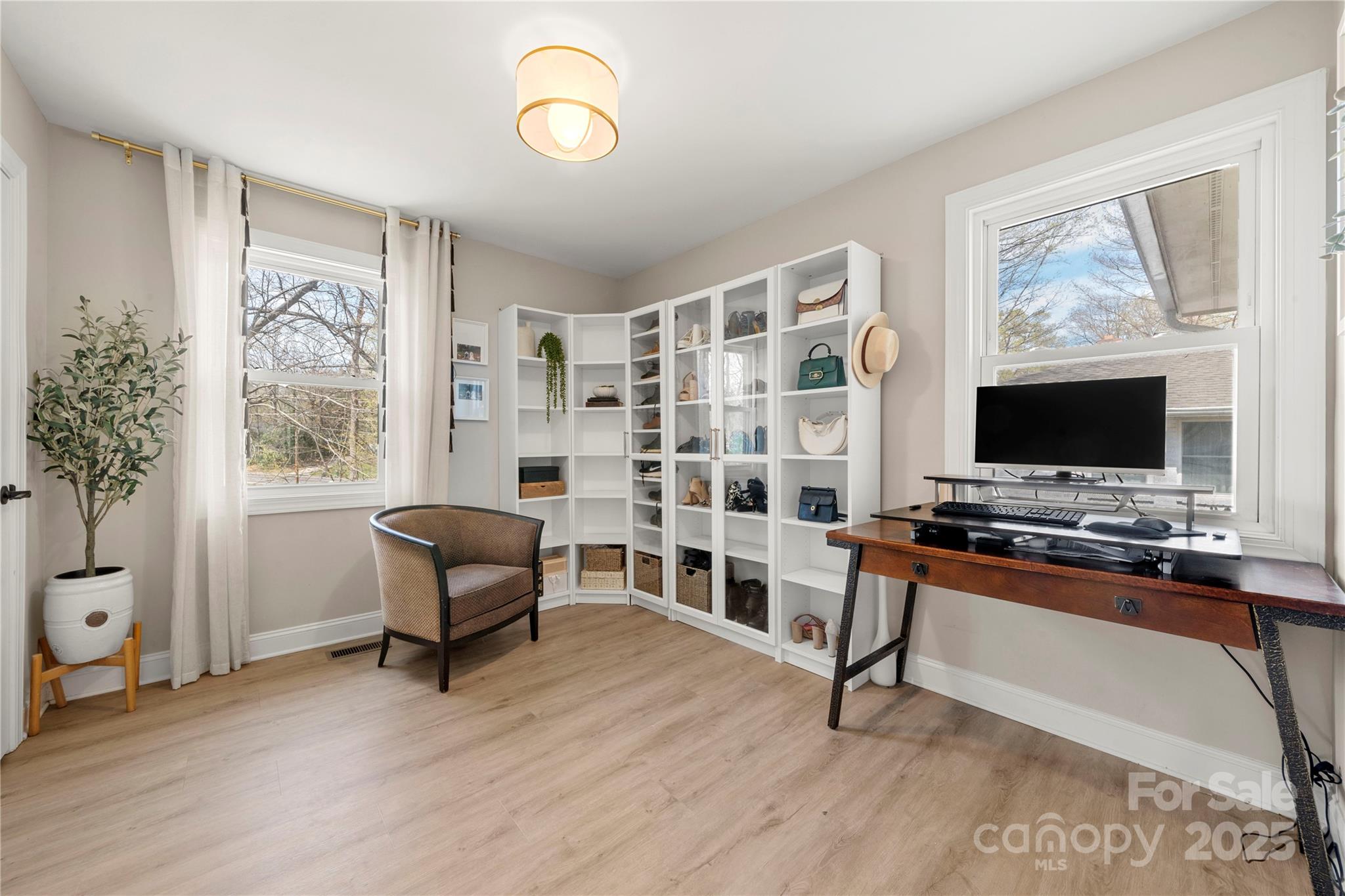 4820 Valley Stream Road Charlotte, NC 28209 - Photo 28 of 37 a living room with furniture and a flat screen tv