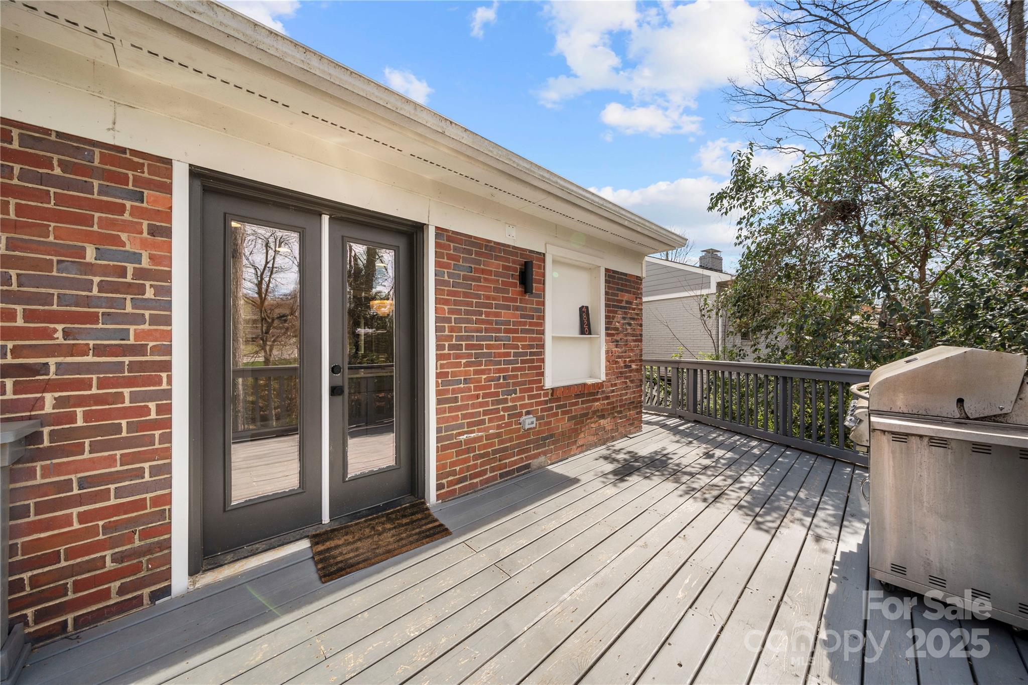 4820 Valley Stream Road Charlotte, NC 28209 - Photo 31 of 37 a view of a house with a wooden deck