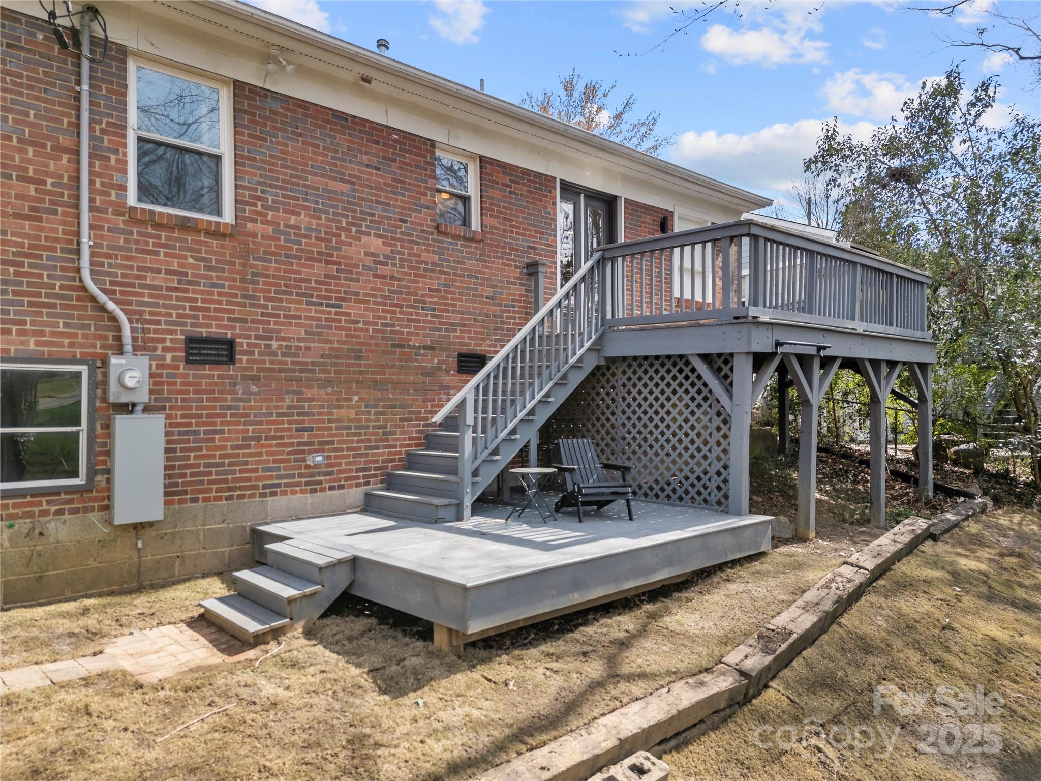 4820 Valley Stream Road Charlotte, NC 28209 - Photo 32 of 37 a view of a patio with a table and chairs