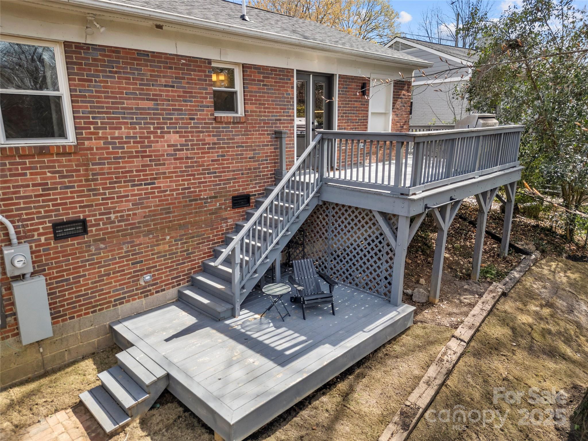 4820 Valley Stream Road Charlotte, NC 28209 - Photo 33 of 37 a view of a deck with wooden floor and fence