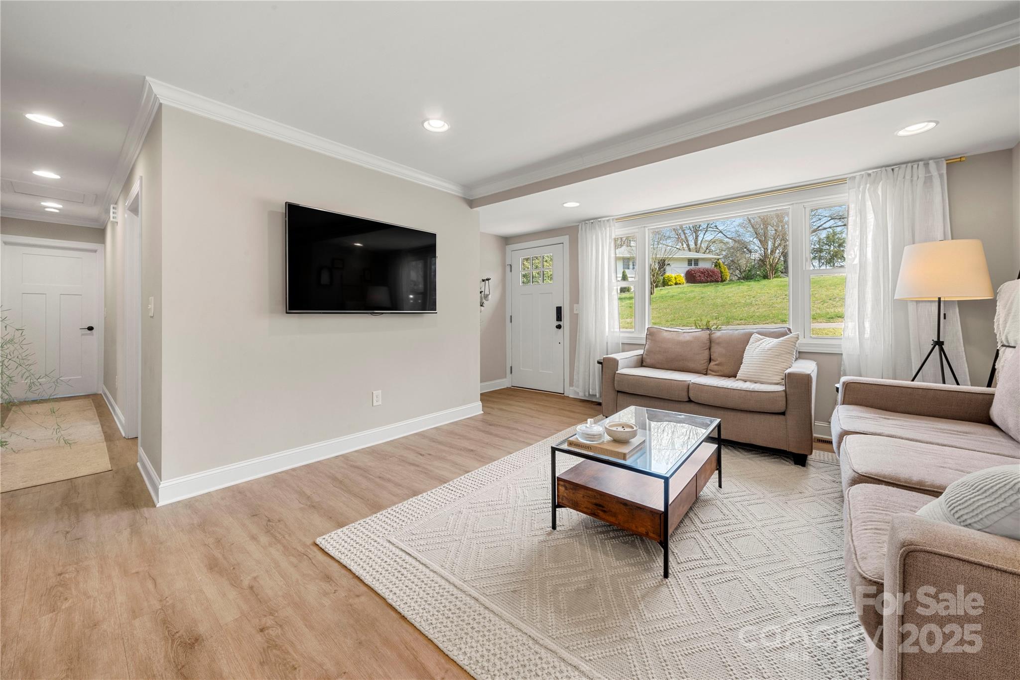 4820 Valley Stream Road Charlotte, NC 28209 - Photo 5 of 37 a living room with furniture and a flat screen tv