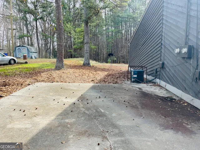 a view of backyard and tree