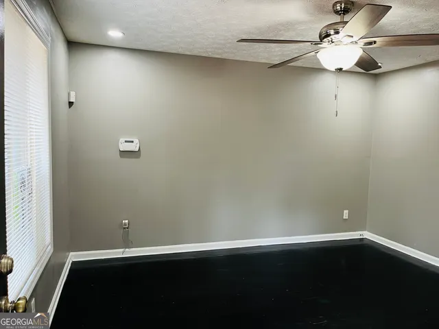 an empty room with wooden floor