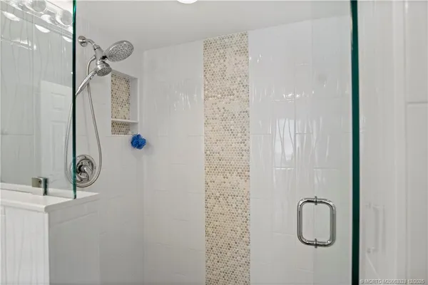 a en suite bathroom with a sink and mirror