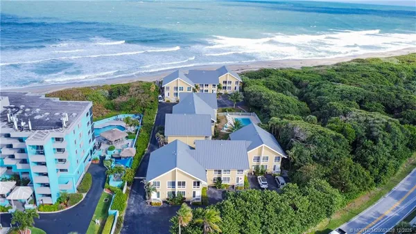 an aerial view of a house with a garden