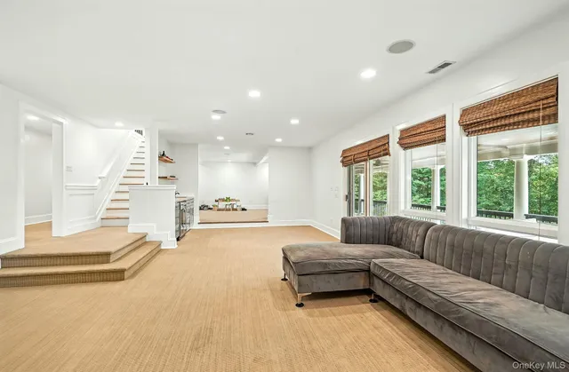 a bathroom with a sink mirror vanity and toilet