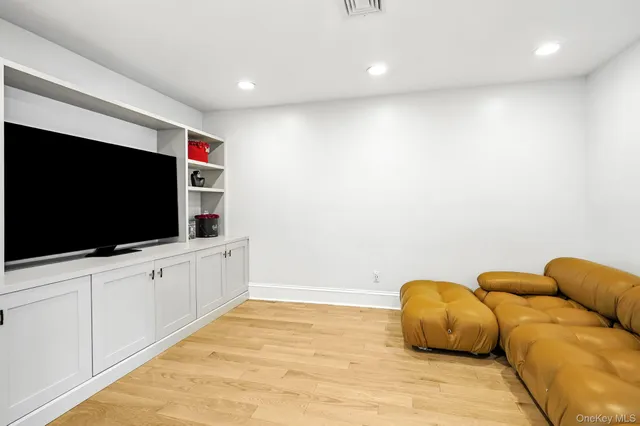 a view of a livingroom with a furniture and a flat screen tv