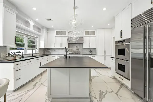 a view of a livingroom with an empty space and a fireplace