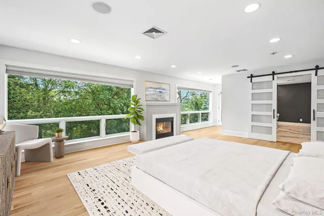 a kitchen with stainless steel appliances granite countertop a sink a stove a refrigerator and cabinets