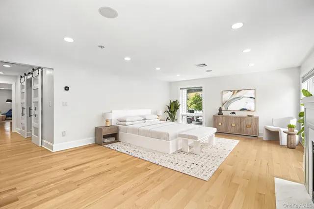 a view of a livingroom with an empty space and a fireplace