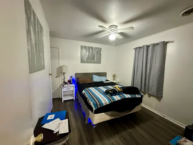 a view of a house with backyard porch and sitting area