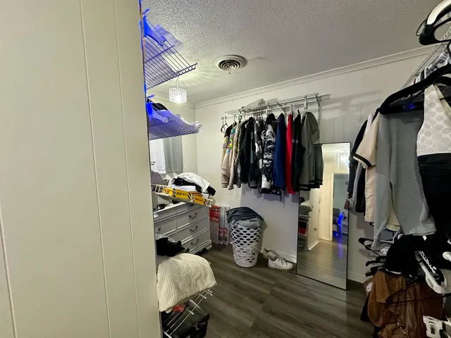 a room with lots of chairs and mirrors