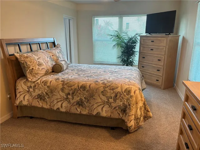 a view of room with window and television