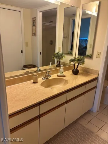 a bathroom with a glass door shower
