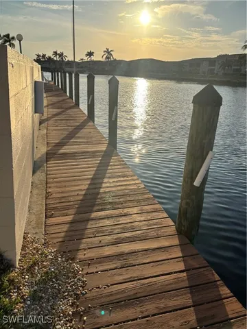 a view of a swimming pool with seating space