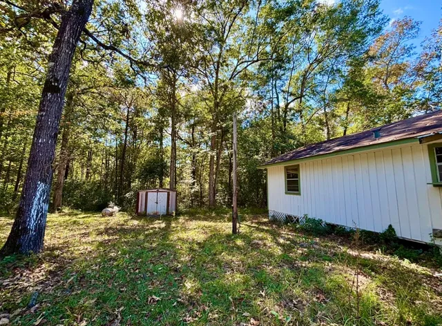 a backyard of a house with lots of green space