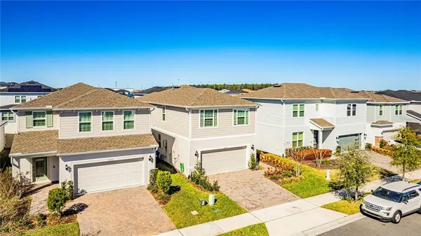 an aerial view of a house with a swimming pool