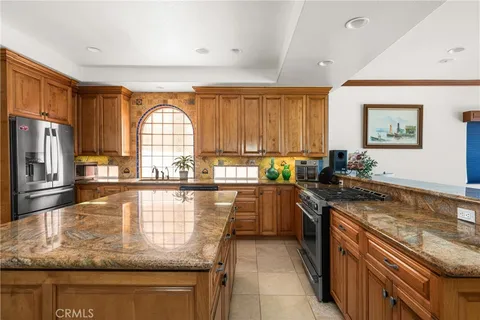 a view of a hallway with dining room and furniture