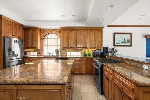 a view of a hallway with dining room and furniture