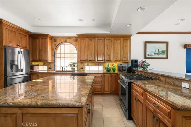 a view of a hallway with dining room and furniture