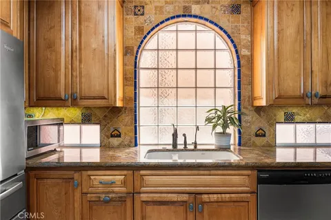a view of entryway with stairs and wooden floor