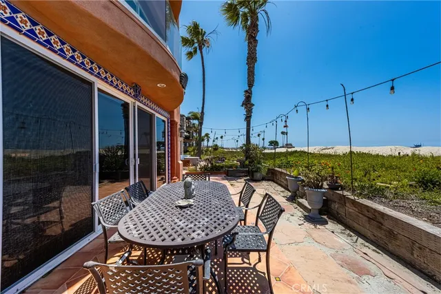 a large kitchen with a large window and stainless steel appliances