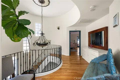 a bedroom with a large bed and a couch