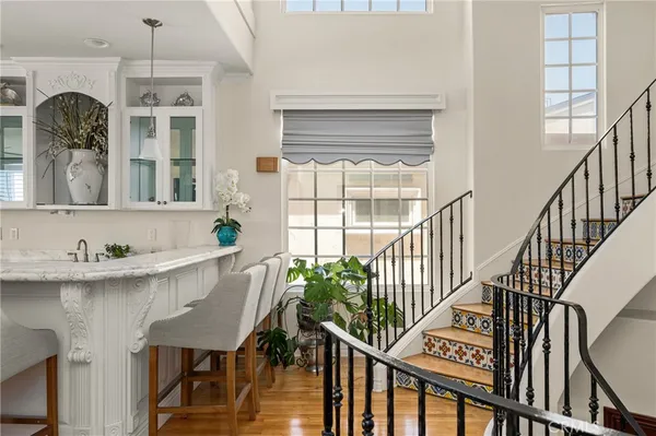 a spacious bathroom with a granite countertop sink and a mirror
