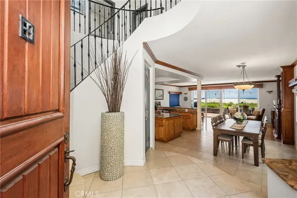 a living room with fireplace furniture and a large window
