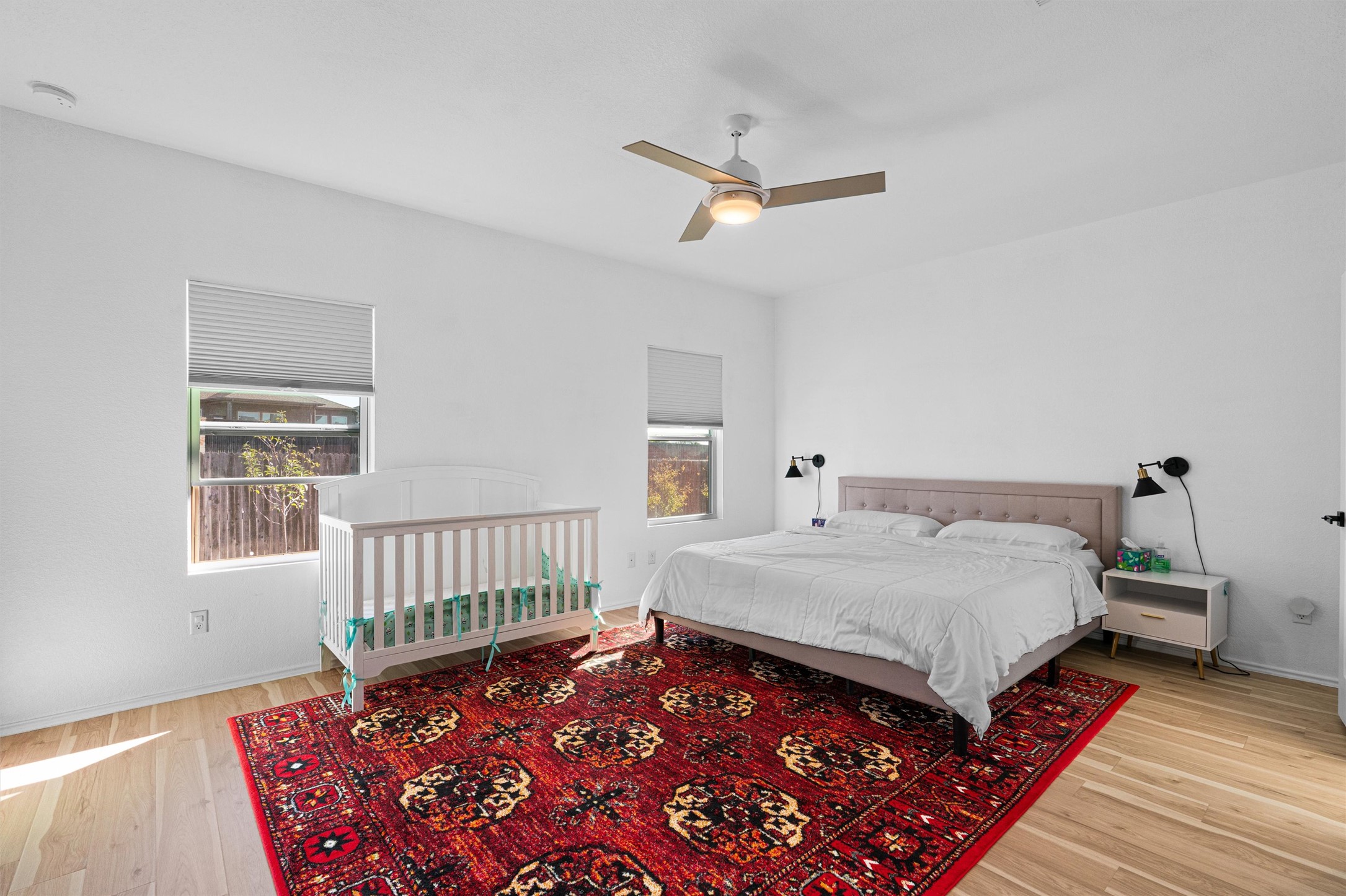 327 Andesite Trail Buda, TX 78610 - Photo 16 of 40 a bed sitting in a bedroom next to a window