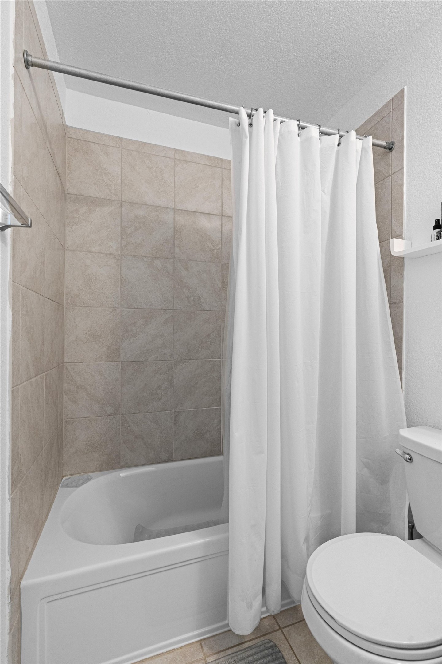 327 Andesite Trail Buda, TX 78610 - Photo 28 of 40 a white toilet sitting next to a bath tub