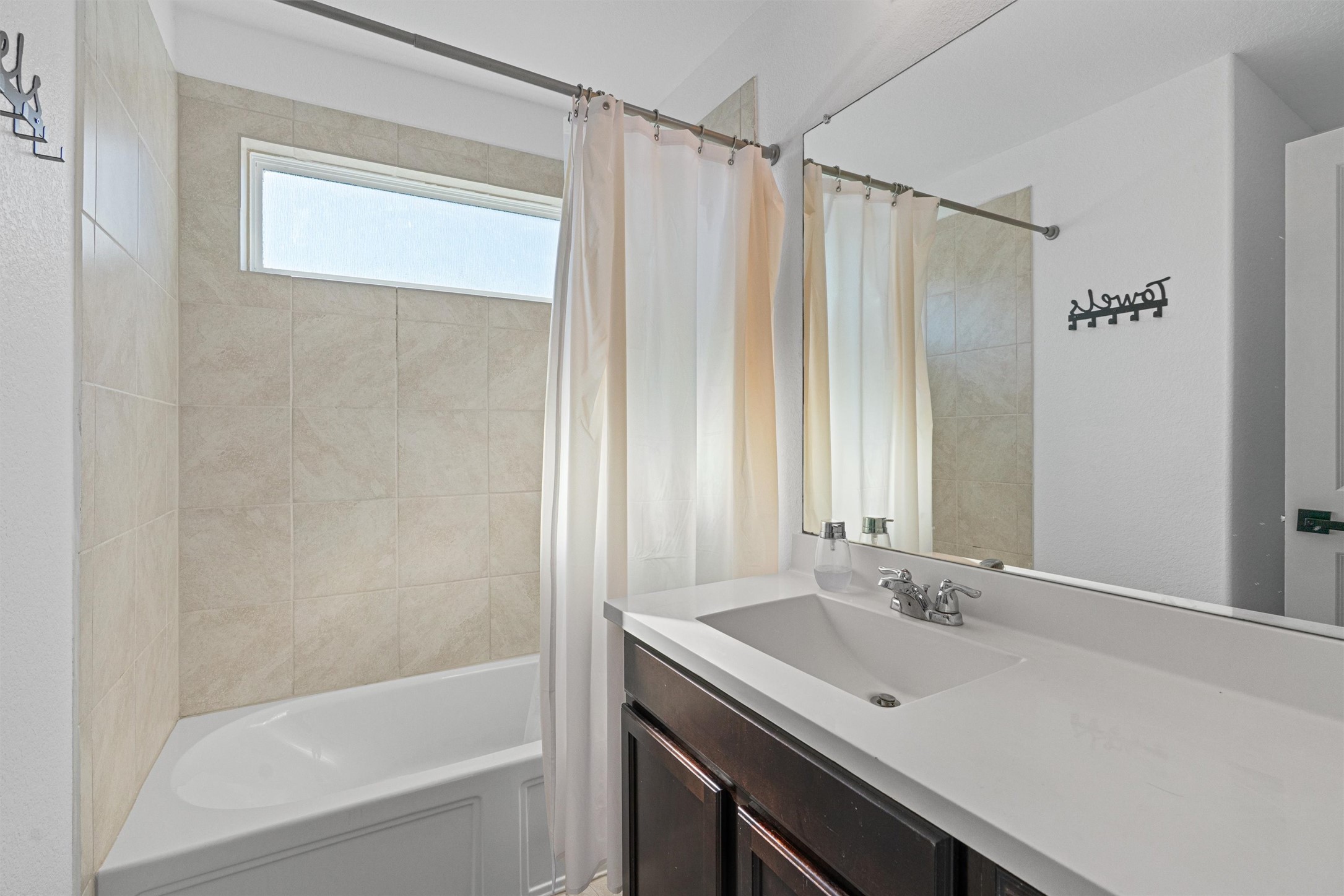 327 Andesite Trail Buda, TX 78610 - Photo 31 of 40 a bathroom with a sink and a mirror