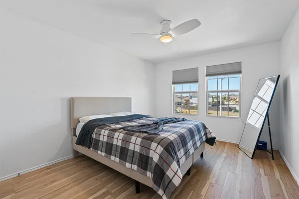 a bedroom with a bed and a window