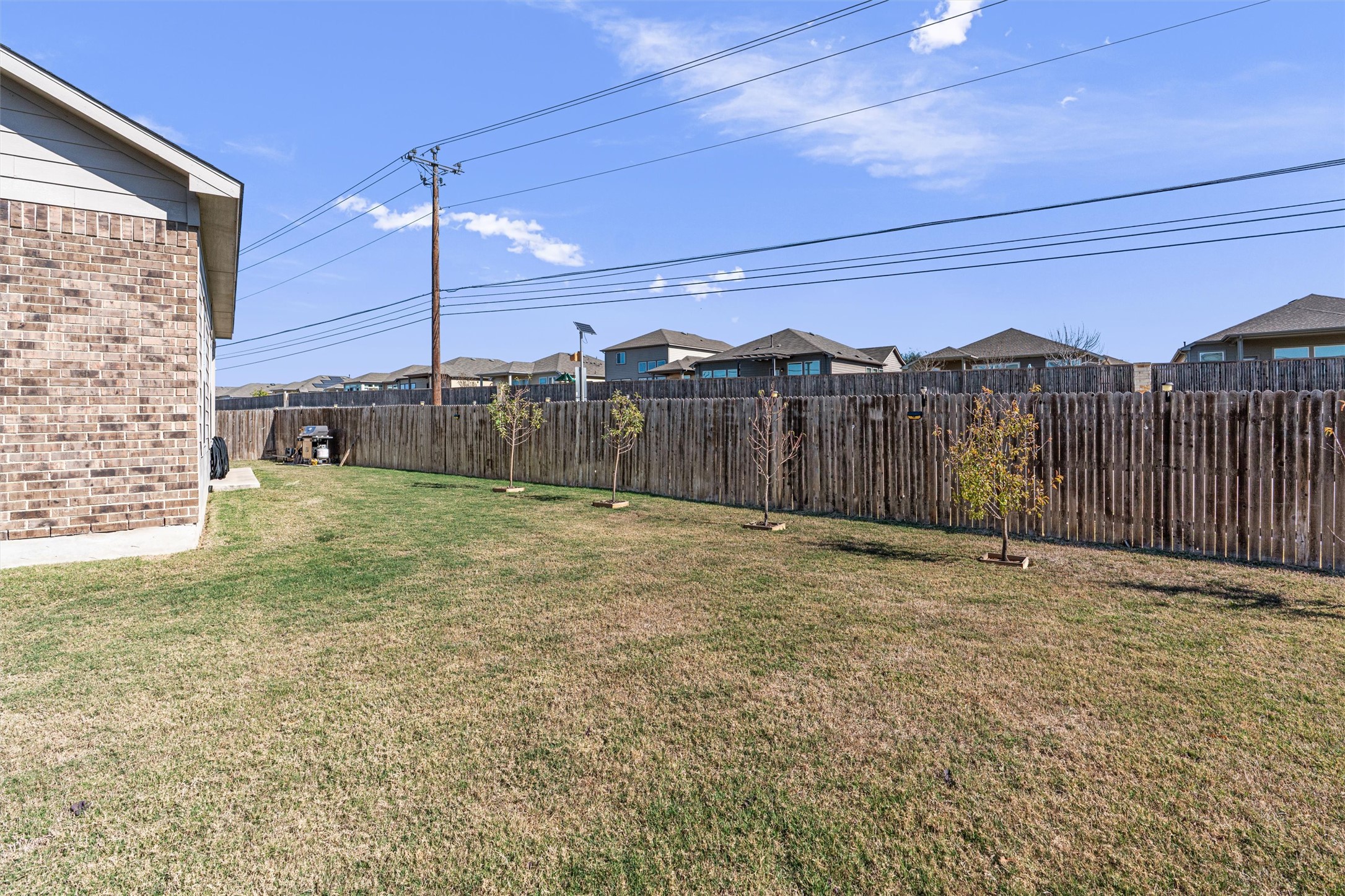 327 Andesite Trail Buda, TX 78610 - Photo 40 of 40 a view of a backyard with a fence